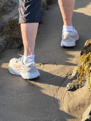 Shoes on beach sand